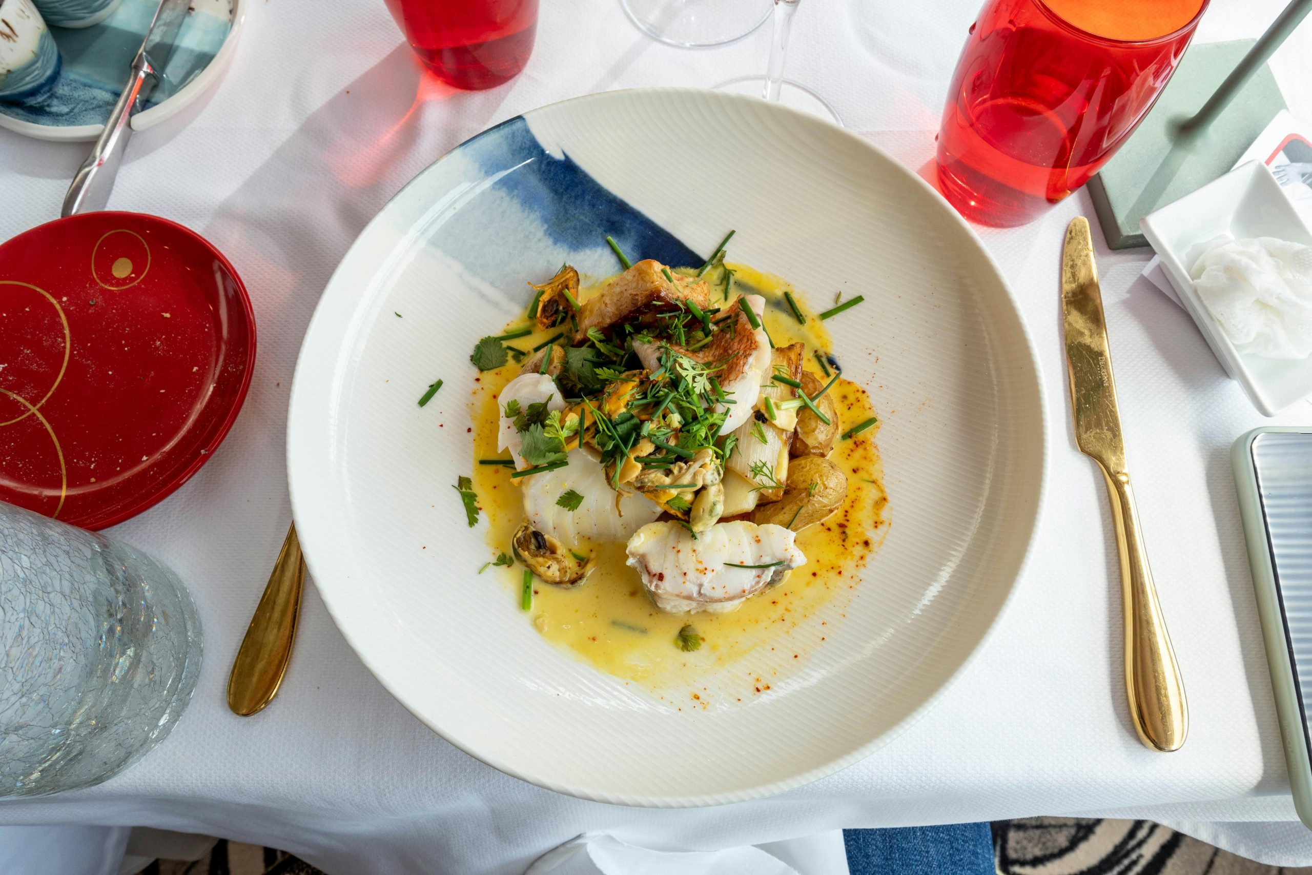 Delicious gourmet seafood platter served at a French restaurant with artistic presentation.